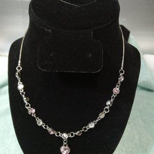 womens necklace  beautiful fashionable silver toned chain with pink toned gems .